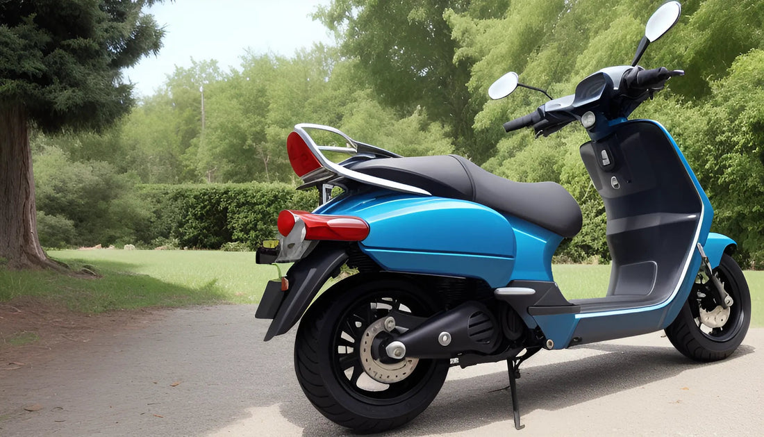 Blue scooter parked on paved path in a green outdoor park setting