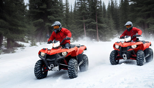 Two riders on red ATVs driving through snowy forest terrain, wearing helmets and jackets.