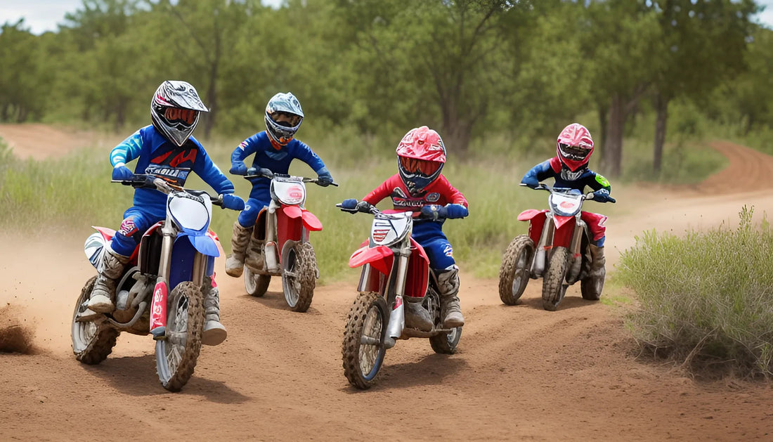 Four kids in motocross gear riding dirt bikes on a dirt trail, youth powersports vehicles