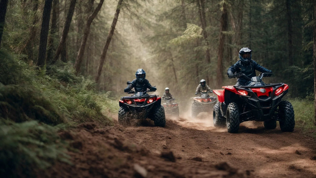 Group of riders on red ATVs driving on a dirt trail through a forest