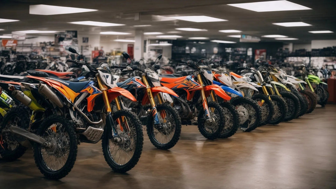 Line of new dirt bikes with knobby tires displayed in a showroom for off-road vehicles