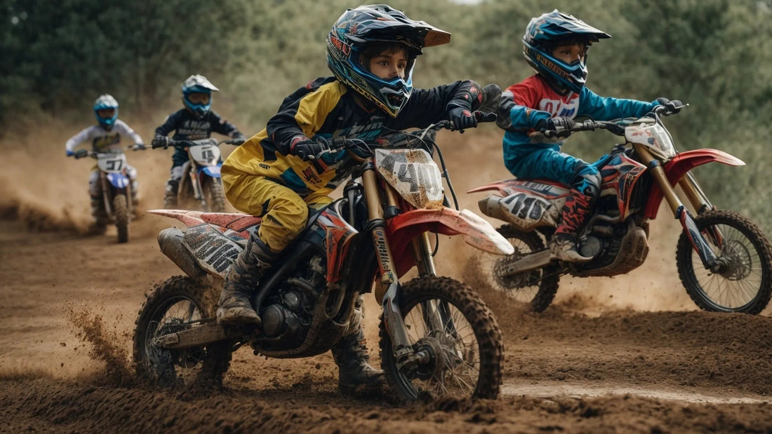 Kids riding dirt bikes and wearing helmets in a motocross race on a dirt track