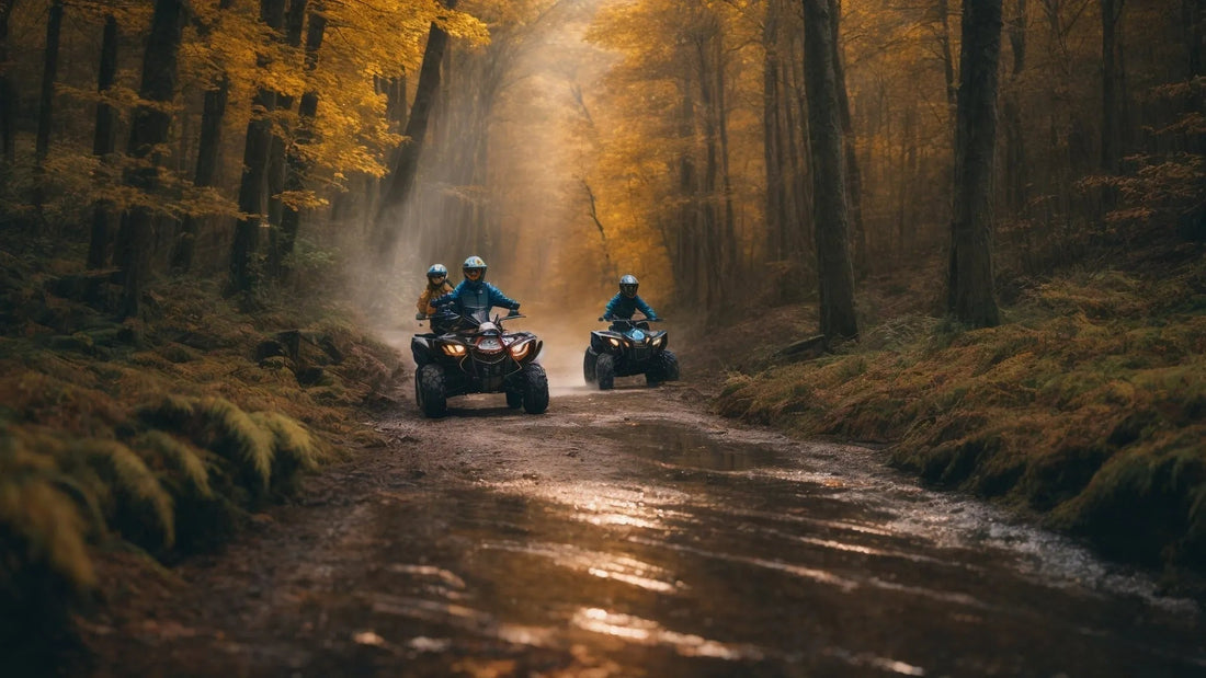 Riders driving ATVs on a muddy forest trail with autumn leaves and sunlight filtering through trees