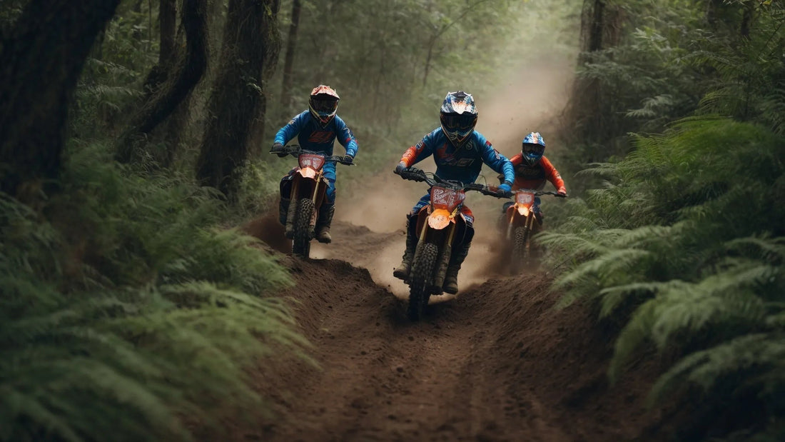 Three riders on dirt bikes racing through a forest trail with helmets and gear