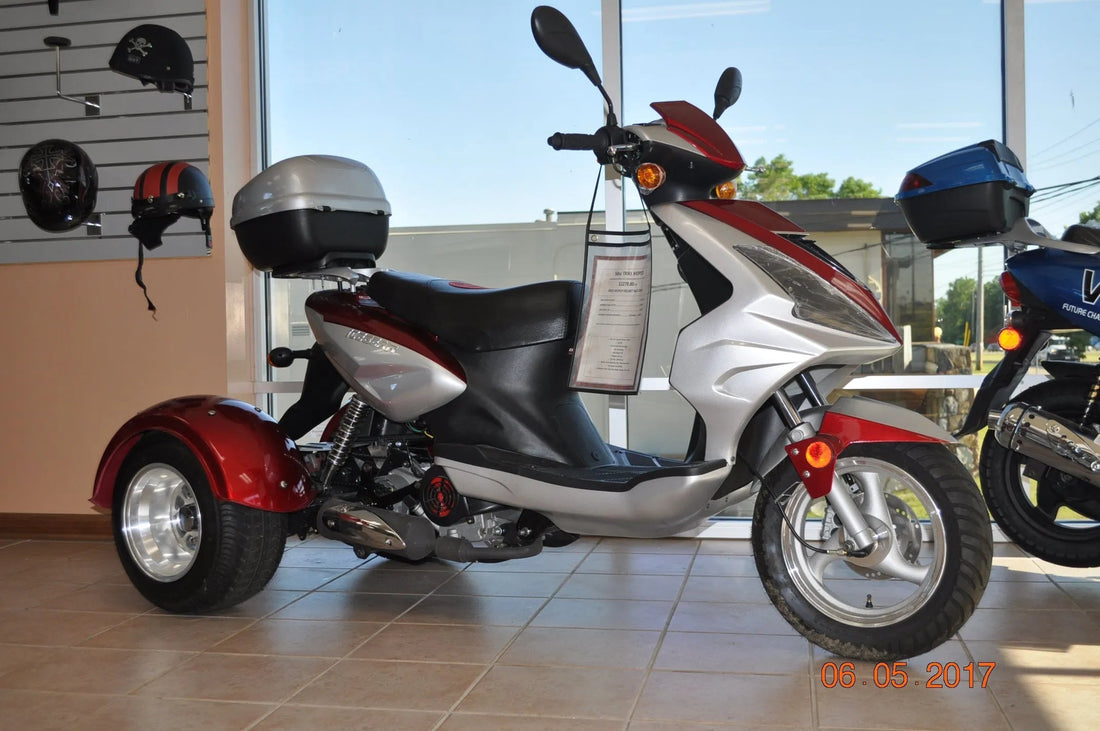 Street legal 150cc three-wheel trike motor scooter with sporty windshield and rear storage trunk for efficient commuting