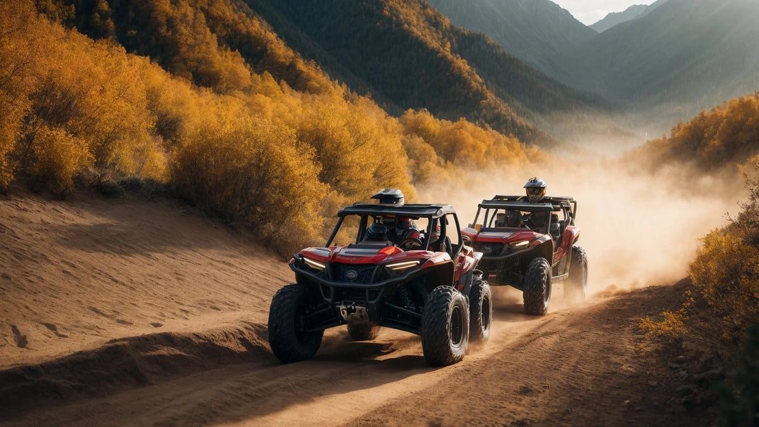 Two red ATVs driving on a dirt trail through fall foliage in a mountain landscape