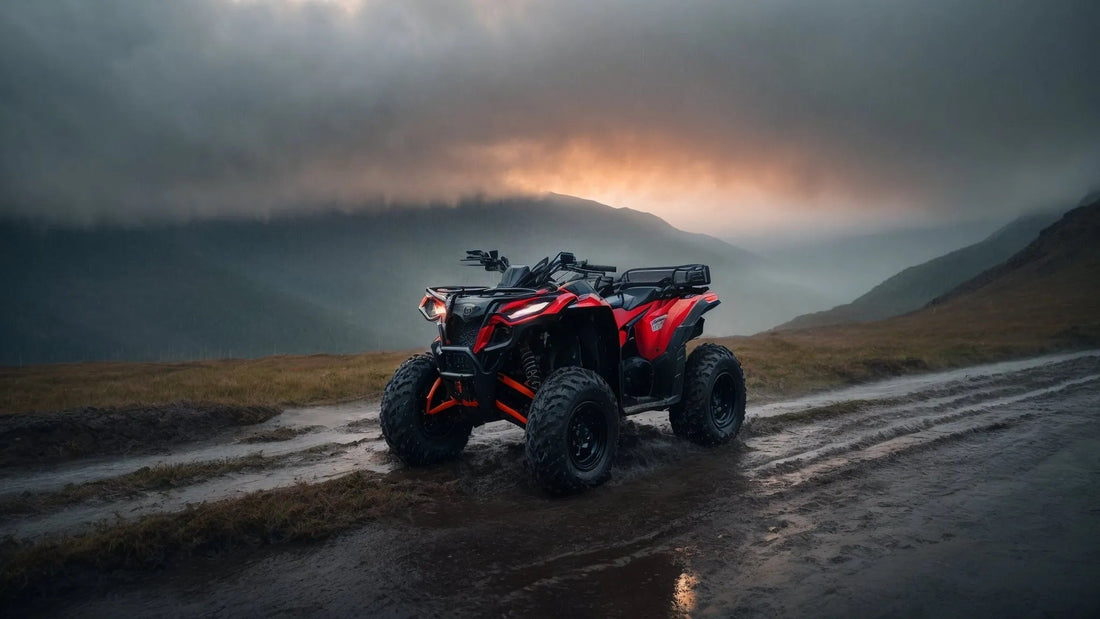Red ATV parked on a muddy trail with mountains and dramatic sunset in the background