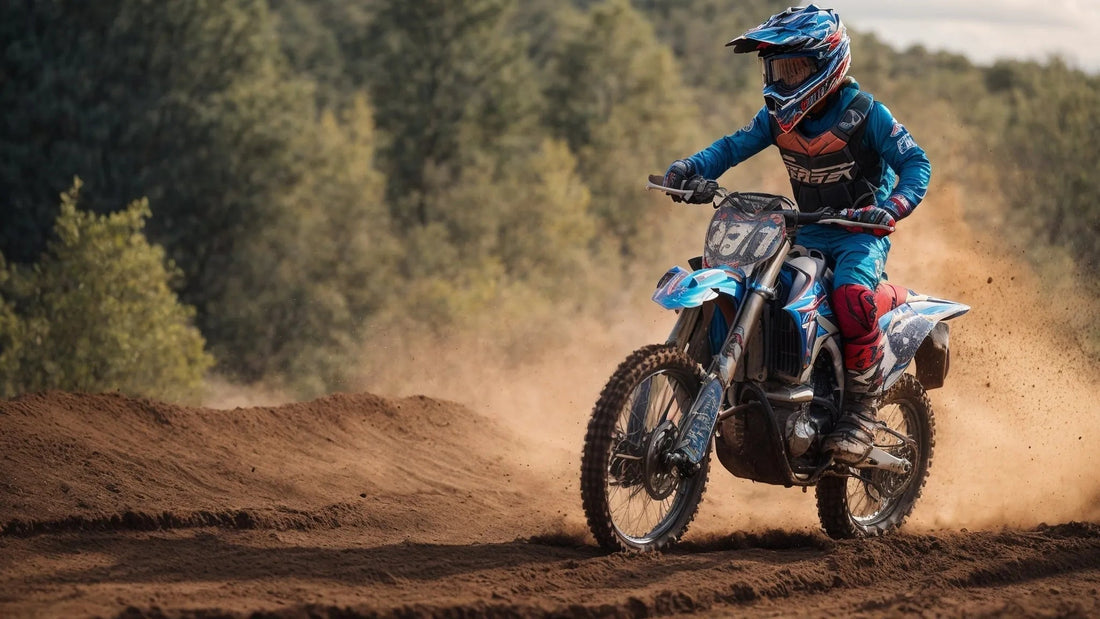 Rider in blue gear on a dirt bike racing off-road on a dusty trail