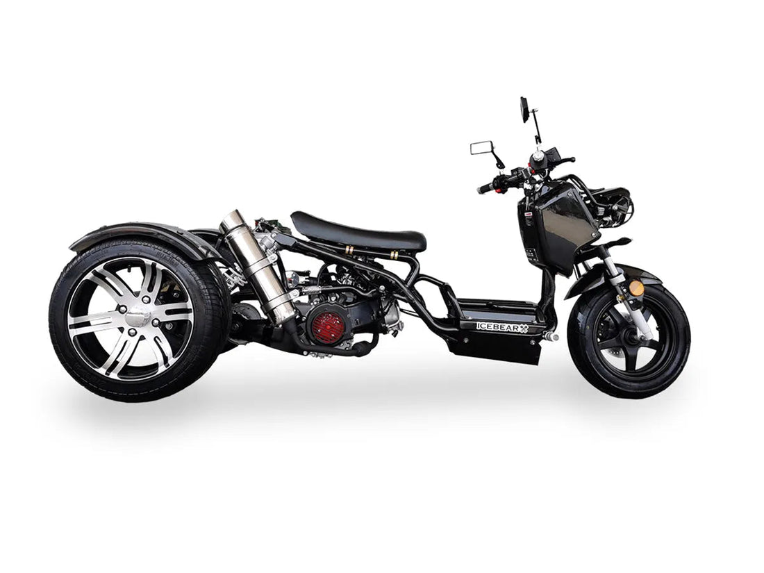 Black three-wheel scooter trike with low seat and alloy rims on white background