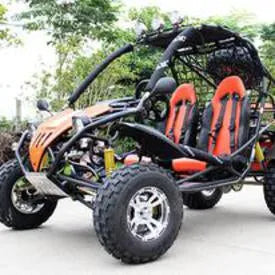 Two-seater off-road go-kart with large tires and orange seats parked outdoors