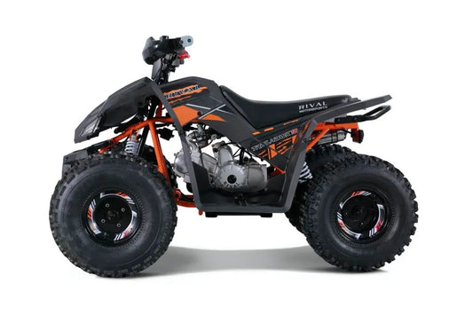 Orange and black youth ATV trail bike with knobby tires on white background