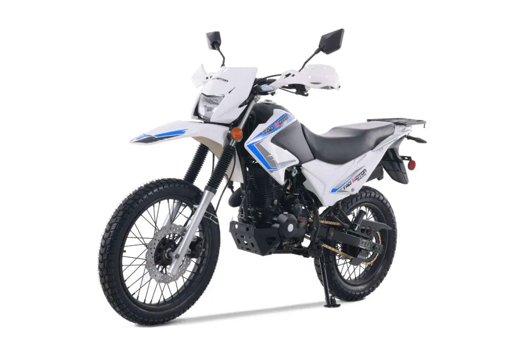 White off-road dirt bike with knobby tires and blue accents on a white background
