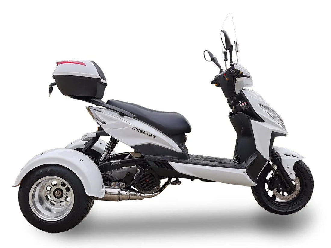 White three-wheel scooter with rear storage box and windshield shown in profile view
