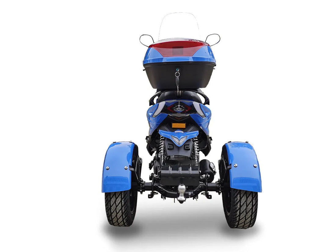 Rear view of blue three-wheeled scooter with storage box and wide tires on white background