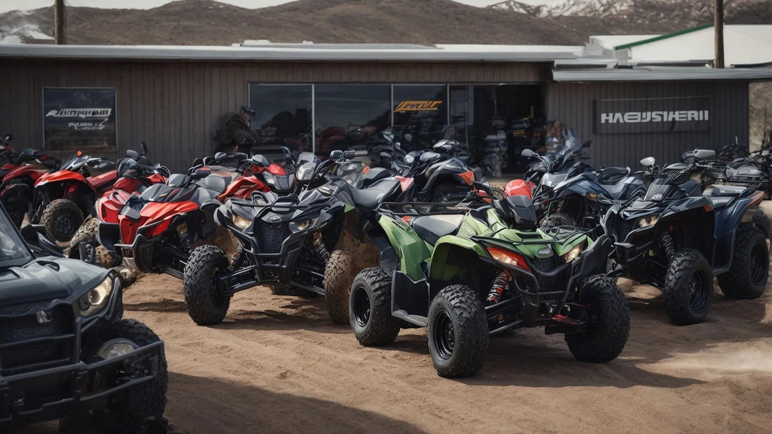 Outdoor lineup of ATVs in various colors parked on dirt in front of a showroom with mountains behind.