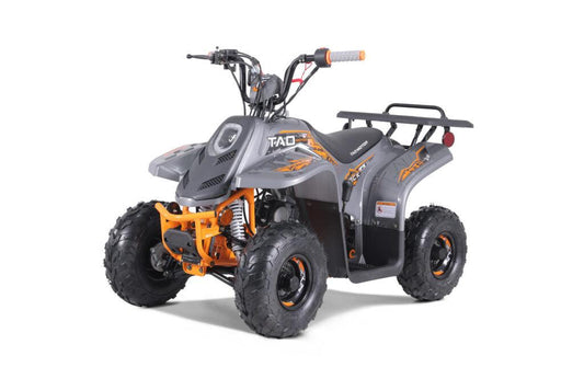 Gray and orange kids four-wheeler ATV with forward and reverse drive, studio background