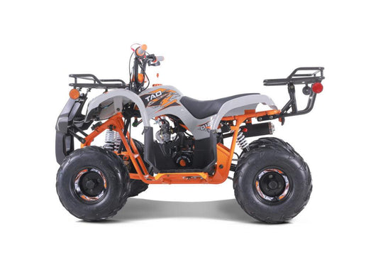 Orange and white youth utility ATV with off-road tires and rear cargo racks, side view