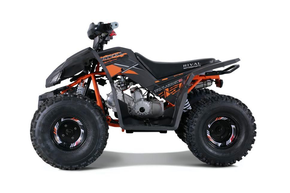 Black and orange Rival Motorsports youth gas-powered ATV with thick off-road tires on white background