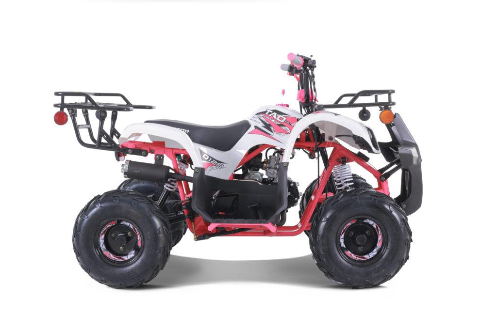 Youth gas-powered utility ATV with off-road tires, racks, and white-pink accents on white background.