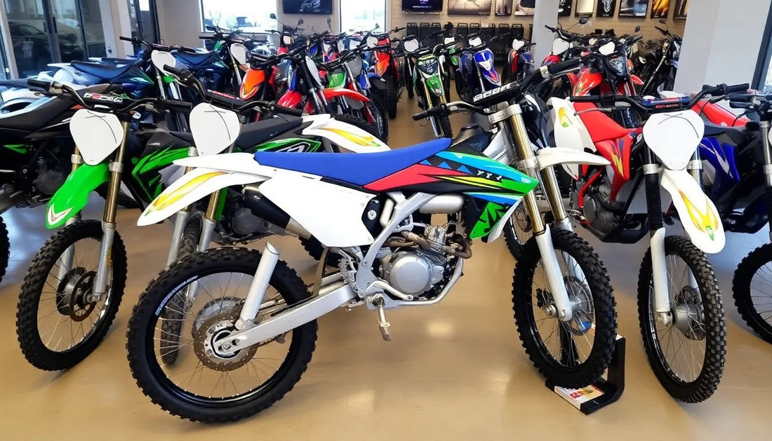 Dirt bikes with colorful graphics displayed in a showroom, off-road motorcycles for sale