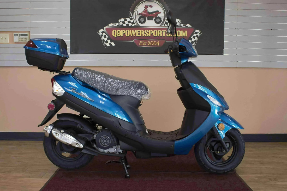 Blue 50cc scooter with top case parked indoors, perfect for campus or city commuting
