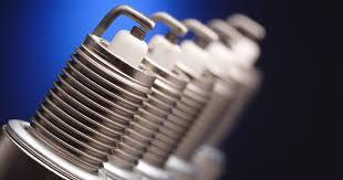Close-up of multiple spark plugs for ATVs, dirt bikes, and powersports vehicles.