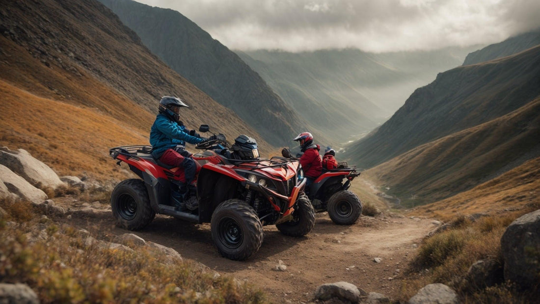 Riders on red ATVs trail riding in rugged mountain terrain under cloudy skies