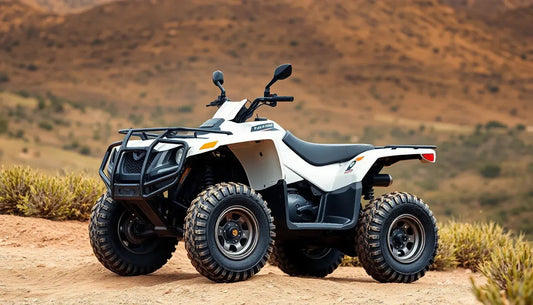 White ATV all-terrain vehicle with rugged tires on a dirt trail in a desert landscape