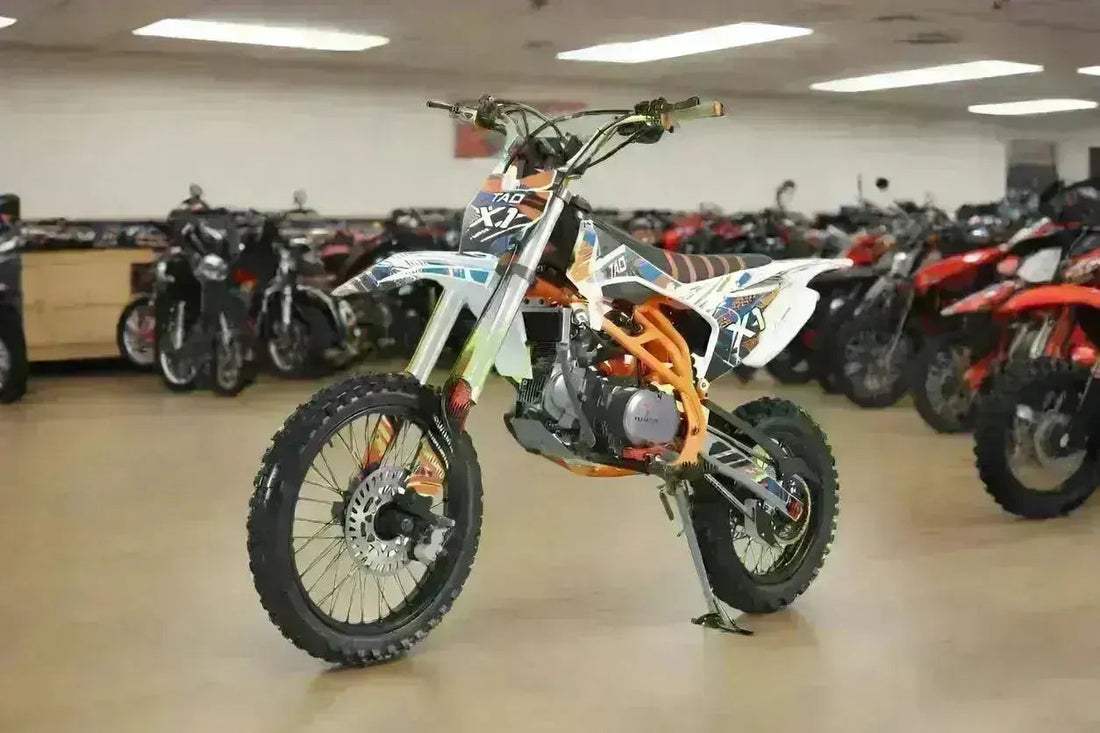 140cc off-road dirt bike with knobby tires and sporty graphics displayed in showroom