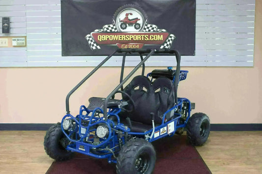 Blue double-seat 110cc kids go-kart with roll cage on showroom floor, off-road tires visible.