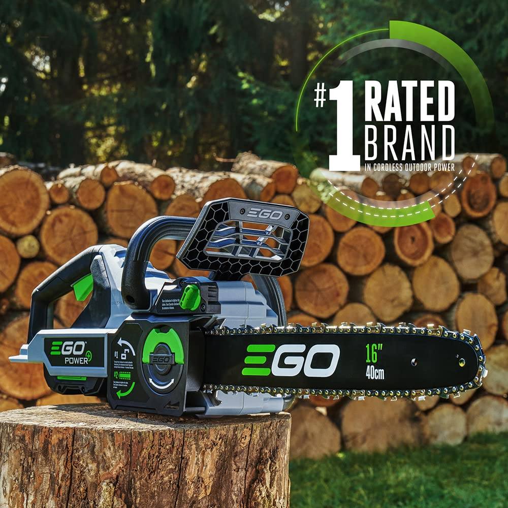EGO Power 16-inch cordless chainsaw on a tree stump with stacked logs outdoors