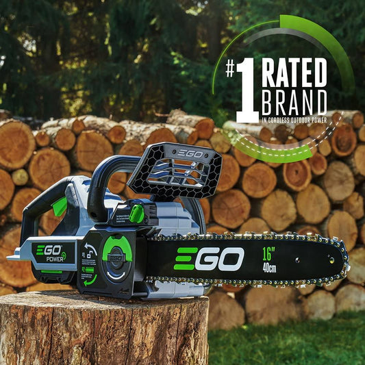 EGO Power 16-inch cordless chainsaw on a tree stump with stacked logs outdoors