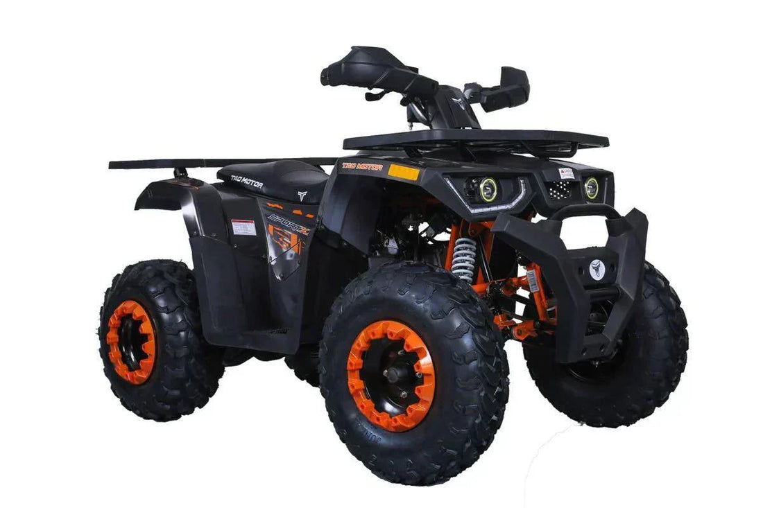Full-size black and orange utility ATV with rugged tires and dual headlights on white background