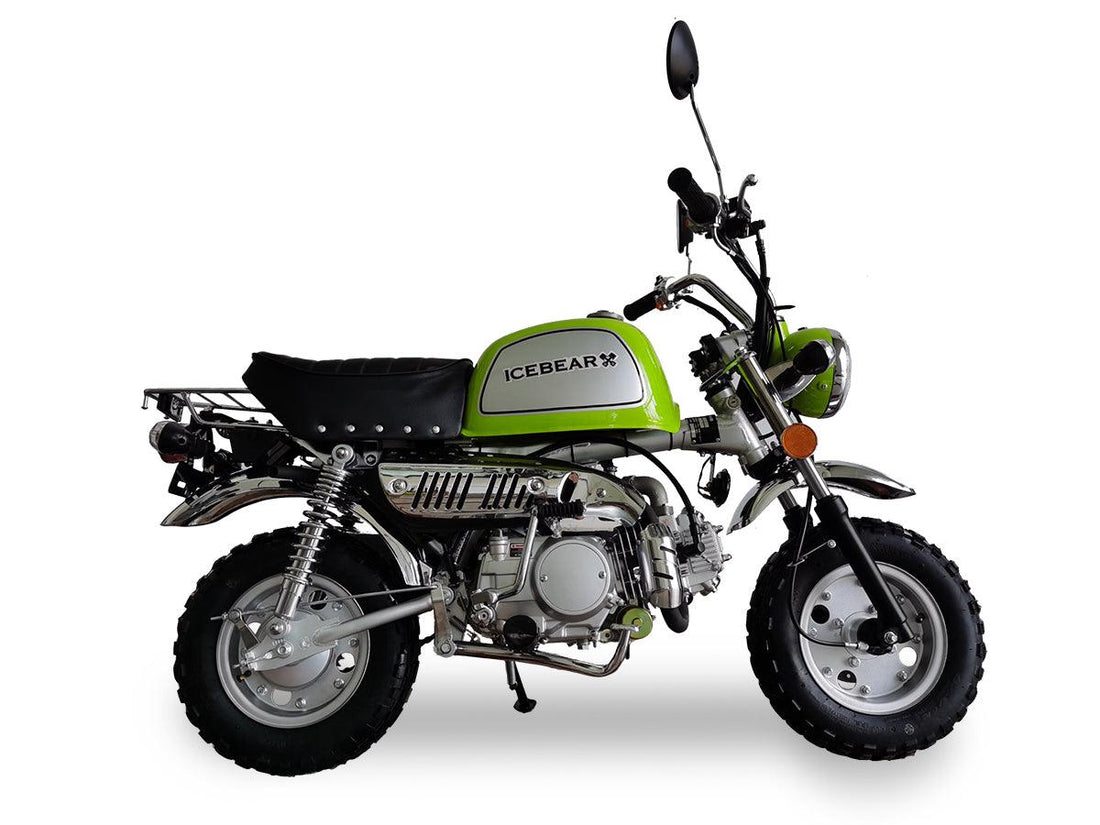 Green ICEBEAR Leo 125cc motorcycle with black seat and knobby tires, side view