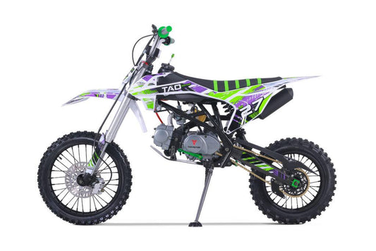 125cc off-road dirt bike with green, purple, and white graphics, kickstand down
