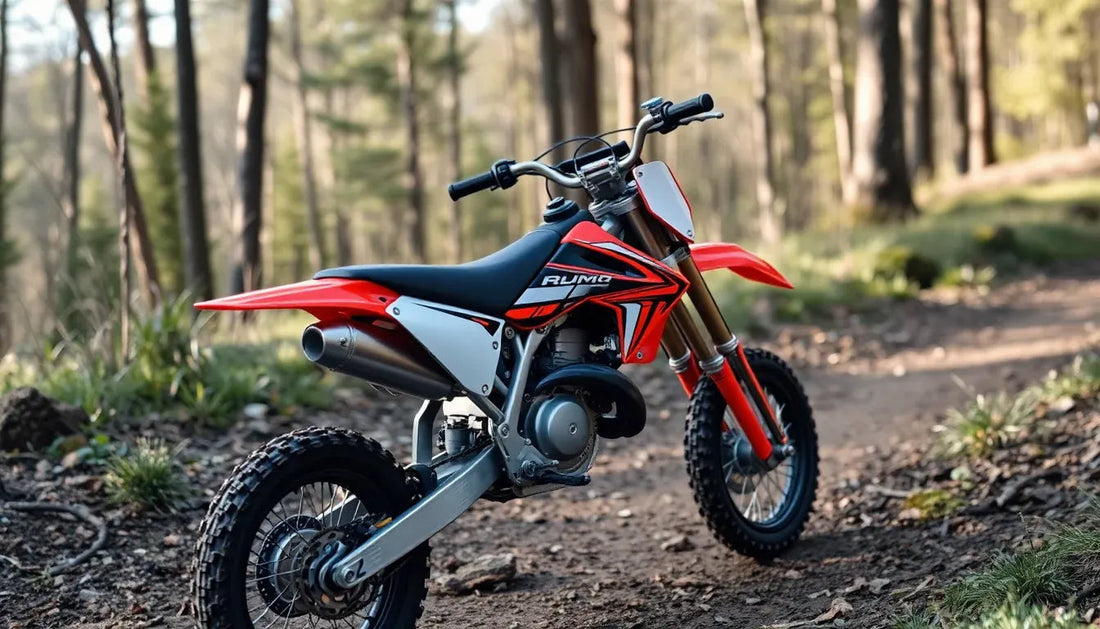 Red dirt bike with off-road tires parked on a forest trail