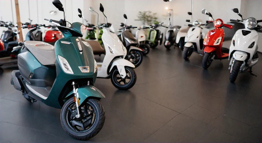 Modern scooters in various colors displayed in a showroom, affordable motor scooters lineup