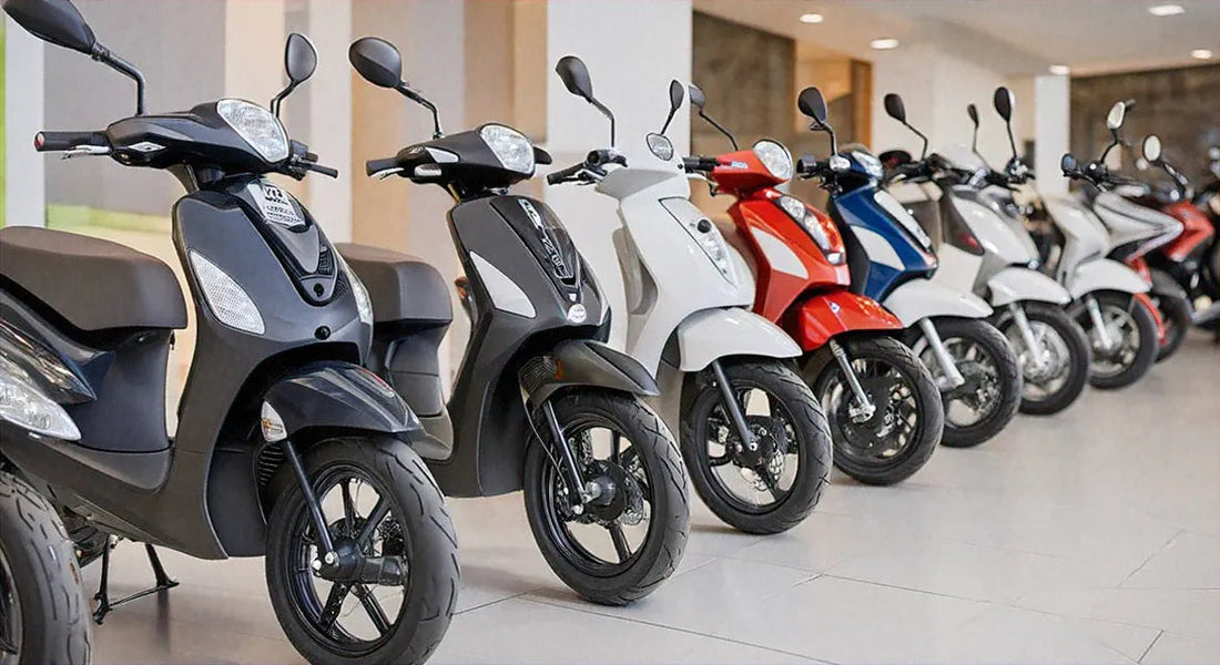 Row of colorful scooters lined up in a showroom with tiled floors