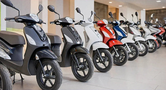 Row of colorful scooters lined up in a showroom with tiled floors