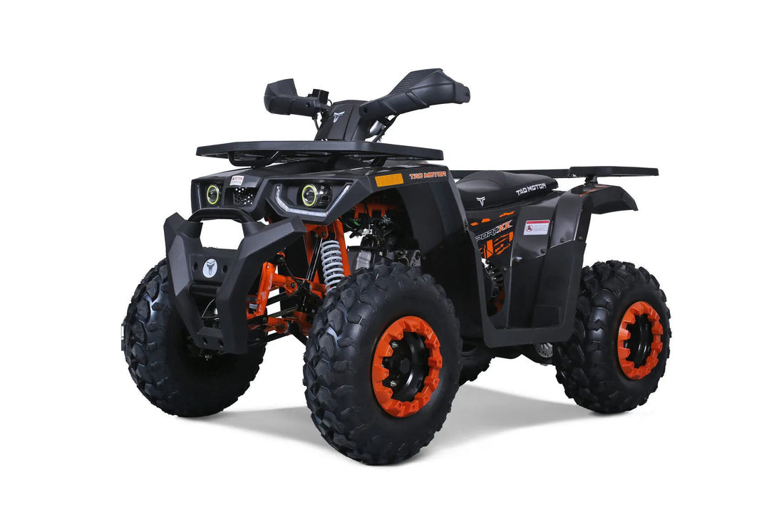 Black and orange all-terrain ATV with rugged tires and modern headlights on white background.