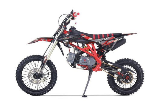 Red and black youth gas-powered dirt bike with off-road tires on white background