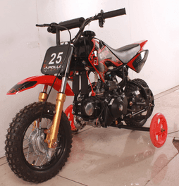 Gas-powered youth dirt bike with number plate and training wheels in a showroom