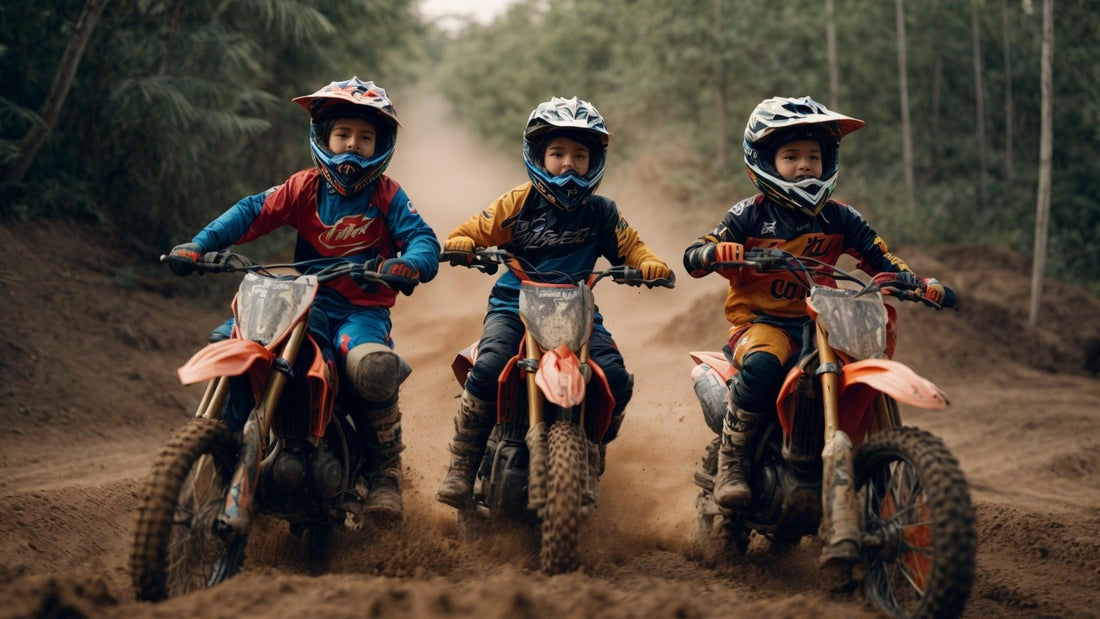 Three kids riding gas-powered youth dirt bikes on a dirt trail in motocross gear