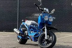 Blue 50cc Maddog scooter parked on asphalt in front of chain-link fence