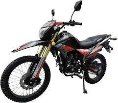 Red and black off-road dirt bike with knobby tires and high ground clearance