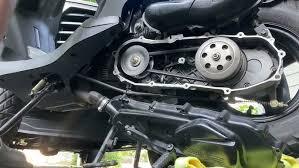 Open motor scooter transmission with exposed drive belt and variator for maintenance