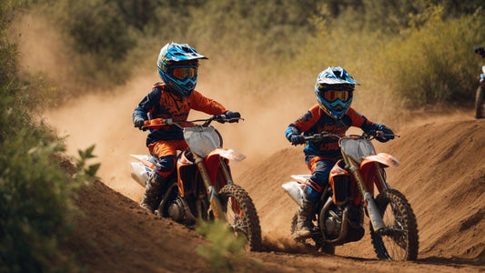 Kids riding orange dirt bikes on a dirt trail, wearing helmets and motocross gear