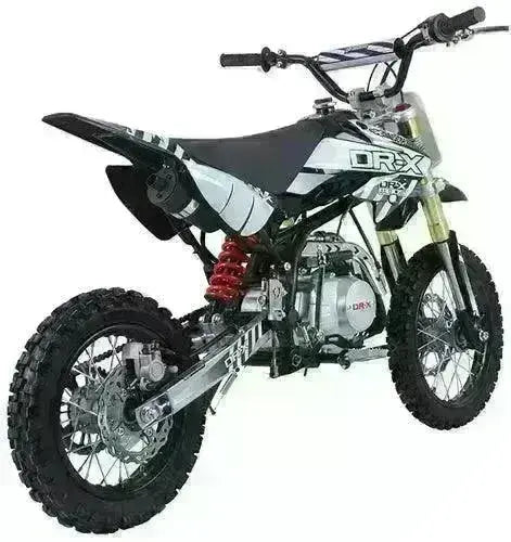 Youth 125cc dirt bike with knobby tires, black and white graphics, off-road suspension