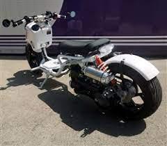 White Maddog 150cc motor scooter parked outdoors on concrete surface