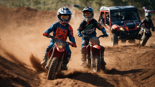 Youth riders on dirt bikes and ATVs racing off-road on a sandy outdoor trail